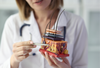 doctor explaining advanced hair treatments near Dorchester