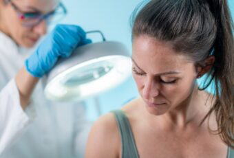 woman at dermatology appointment near Stoughton MA